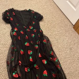 strawberry dress, low in chest area, frilly.